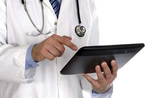 Doctor using digital tablet